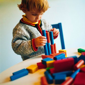 children picking up toys